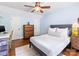 Bedroom with hardwood floors, ceiling fan and white trim at 1209 Yale Pl, Charlotte, NC 28209