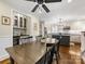 Dining area adjacent to kitchen and bar area, hardwood floors, and natural light at 1209 Yale Pl, Charlotte, NC 28209