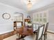Elegant dining room with a hardwood table, chandelier, and sophisticated decor at 1209 Yale Pl, Charlotte, NC 28209