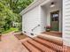 Charming front entrance with brick steps and olive-green door at 1209 Yale Pl, Charlotte, NC 28209