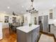 Kitchen featuring stainless steel appliances, central island, and an adjacent dining area at 1209 Yale Pl, Charlotte, NC 28209