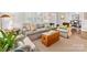 Bright and airy living room with stylish sofa, wood chest coffee table, and neutral décor at 1209 Yale Pl, Charlotte, NC 28209