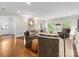 Spacious living room featuring hardwood floors, comfortable seating, and French doors at 1209 Yale Pl, Charlotte, NC 28209