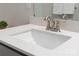 Close-up of a bathroom sink with a quartz countertop and brushed nickel fixtures at 131 Berkeley Ave # D, Mooresville, NC 28117