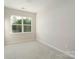 Bright bedroom with large windows offering natural light and views of the outdoors at 131 Berkeley Ave # D, Mooresville, NC 28117