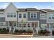 Well-maintained townhome with lovely landscaping, steps to door, and neutral color scheme at 131 Berkeley Ave # D, Mooresville, NC 28117