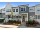 Charming townhome with landscaped front yard, colorful flowers, and inviting entrance at 131 Berkeley Ave # D, Mooresville, NC 28117