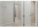 Hallway featuring neutral carpeting and convenient access to other rooms at 131 Berkeley Ave # D, Mooresville, NC 28117