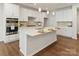Modern kitchen with stainless steel appliances, white cabinets, and a spacious center island at 131 Berkeley Ave # D, Mooresville, NC 28117