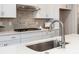 Modern kitchen with stainless steel sink and faucet at 131 Berkeley Ave # D, Mooresville, NC 28117