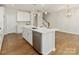 Kitchen island featuring a stainless steel dishwasher and sink at 131 Berkeley Ave # D, Mooresville, NC 28117