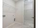 Functional laundry room with washer and dryer hookups and shelving at 131 Berkeley Ave # D, Mooresville, NC 28117