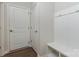 Welcoming mudroom features wood floors, convenient hooks, and built-in bench with storage, perfect for organization at 131 Berkeley Ave # D, Mooresville, NC 28117