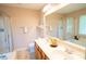 Bright bathroom featuring double sinks, a soaking tub with shower, and tile floors at 134 Walmsley Pl, Mooresville, NC 28117