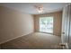 Comfortable bedroom with neutral carpet and a window for natural light at 134 Walmsley Pl, Mooresville, NC 28117