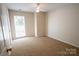 Empty bedroom with carpet, neutral walls, and a bright window at 134 Walmsley Pl, Mooresville, NC 28117