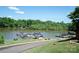 Picturesque lake view featuring boat docks, lush greenery, and serene waters at 134 Walmsley Pl, Mooresville, NC 28117