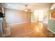 Spacious living room with wood floors, ceiling fan, and ample natural light at 134 Walmsley Pl, Mooresville, NC 28117