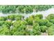 Aerial view of waterfront homes surrounded by mature trees at 141 Culpeze Rd, Mooresville, NC 28117
