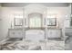 Bright bathroom featuring a soaking tub, dual vanities, and decorative tile accents at 141 Culpeze Rd, Mooresville, NC 28117
