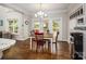 Dining area with hardwood floors, modern light fixture, and view of outdoor patio at 141 Culpeze Rd, Mooresville, NC 28117