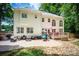 Rear exterior view of the home with a patio and deck for outdoor entertaining at 141 Culpeze Rd, Mooresville, NC 28117