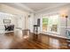 Spacious foyer featuring gleaming hardwood floors, decorative columns, and large windows at 141 Culpeze Rd, Mooresville, NC 28117