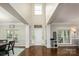 Grand foyer with soaring ceilings, hardwood floors, and large windows providing natural light at 141 Culpeze Rd, Mooresville, NC 28117