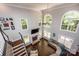 Bright, airy living room with soaring windows, a stone fireplace, and an open layout at 141 Culpeze Rd, Mooresville, NC 28117