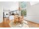 Charming breakfast nook with large windows, a round table, and a view of the kitchen area at 14812 Stonegreen Ln, Huntersville, NC 28078