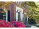 Close-up of the front door with sidelights and colorful flowers adding to the home's appeal at 14812 Stonegreen Ln, Huntersville, NC 28078