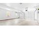 Spacious two-car garage with an automatic door and natural light from two windows at 14812 Stonegreen Ln, Huntersville, NC 28078