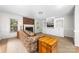 Cozy living room featuring a brick fireplace, plush sofa, and built-in shelving at 14812 Stonegreen Ln, Huntersville, NC 28078