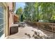 Spacious outdoor deck offers a relaxing retreat with a table set and wooded views at 14812 Stonegreen Ln, Huntersville, NC 28078