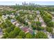 Charming neighborhood with a view of the city skyline, showcasing mature trees and well-maintained homes at 1508 Peaceful Way Dr, Charlotte, NC 28206