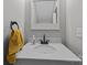 Well-lit powder room featuring a modern sink, vanity, and sleek fixtures at 1508 Peaceful Way Dr, Charlotte, NC 28206