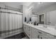 Bathroom with double sink vanity and shower with curtain at 1508 Peaceful Way Dr, Charlotte, NC 28206