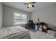 Bedroom featuring large window for natural light. Bed frame without headboard at 1508 Peaceful Way Dr, Charlotte, NC 28206