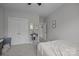 Neutral bedroom with carpeted floors, white closets, and ceiling fan at 1508 Peaceful Way Dr, Charlotte, NC 28206