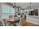 Bright breakfast nook with a view into the modern kitchen and stainless appliances at 1508 Peaceful Way Dr, Charlotte, NC 28206