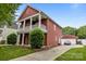Charming two-story home with a front porch and manicured lawn at 1508 Peaceful Way Dr, Charlotte, NC 28206