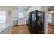 Contemporary kitchen showcasing white cabinetry, stainless steel appliances, and a stylish marble backsplash at 1508 Peaceful Way Dr, Charlotte, NC 28206