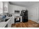 Modern kitchen features stainless steel appliances and white cabinetry at 1508 Peaceful Way Dr, Charlotte, NC 28206