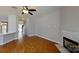 Bright living room featuring a cozy fireplace and hardwood floors throughout the space at 1508 Peaceful Way Dr, Charlotte, NC 28206