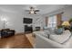 Comfortable living room with a fireplace, large TV, and a plush sectional sofa at 1508 Peaceful Way Dr, Charlotte, NC 28206
