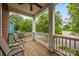 Cozy porch area with chairs and a table, perfect for relaxing outdoors at 1508 Peaceful Way Dr, Charlotte, NC 28206