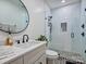 Modern bathroom with patterned tile, glass-enclosed shower, and stylish vanity at 1525 Shinnville Rd, Cleveland, NC 27013