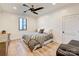Cozy bedroom with hardwood floors, ceiling fan, and ample natural light at 1525 Shinnville Rd, Cleveland, NC 27013