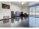 Open garage featuring custom black cabinets, work space and roll up glass garage doors at 1525 Shinnville Rd, Cleveland, NC 27013