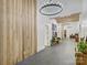 Hallway with wood accent wall, statement lighting and view into a dining area at 1525 Shinnville Rd, Cleveland, NC 27013